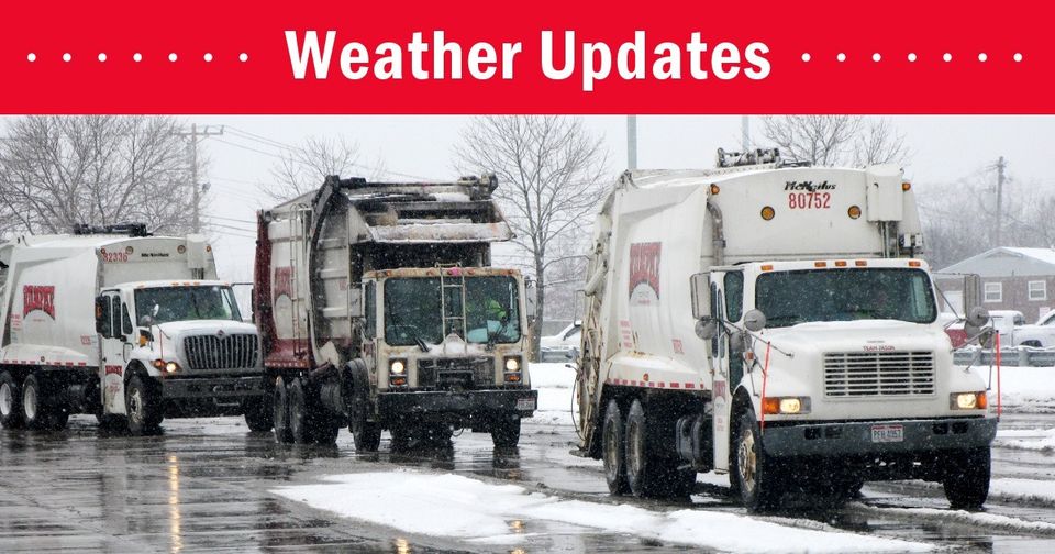 Three garbage trucks drive on a snowy road under an overcast sky with a 