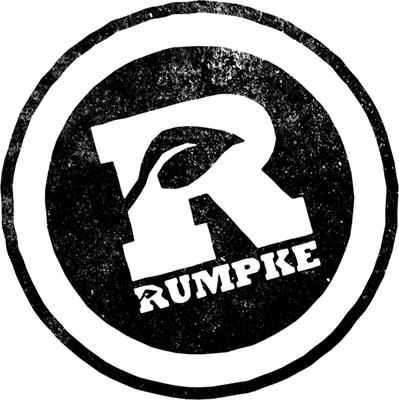 A black and white circular logo featuring a large letter 